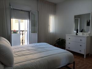 Posteľ alebo postele v izbe v ubytovaní Apartamento O Vento
