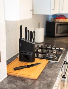a knife block sitting on top of a kitchen counter at Royal Retreat & Lego Lodge in London