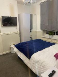 Säng eller sängar i ett rum på Better Bromley
