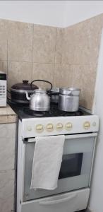 A kitchen or kitchenette at Apart Hotel - Eucaliptal