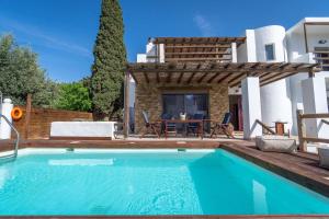 a villa with a swimming pool and a house at Apollonas & Sibylla Villa - Luxury Stay with Pool in Kalymnos