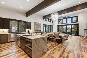 an open kitchen and dining room with a table and chairs at Latitude Adjustment in Whitefish