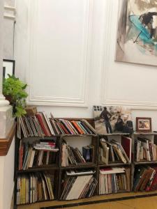 a bunch of books on shelves in a room at Casa Viva Hotel Boutique in Junín