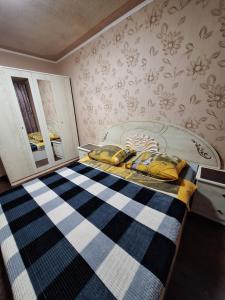 Кровать или кровати в номере Назарбаева 204