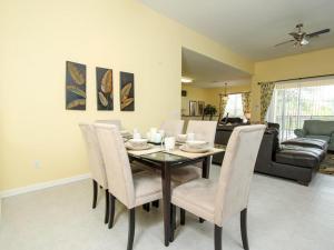 a dining room with a table and chairs at Comrow Villa 7739 in Orlando