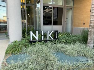 a nitz sign in front of a building at 915 Lux Studio Allianz Park in Sao Paulo