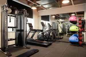 a gym with several treadmills and exercise bikes at Sonder Market Hall in Chicago