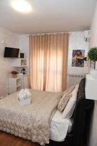 a bedroom with a large bed with a box on it at Casa Donna di Cuori in Fiumicino