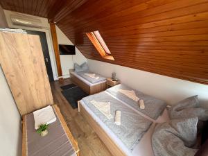 Postel nebo postele na pokoji v ubytování Zomi Vendégház