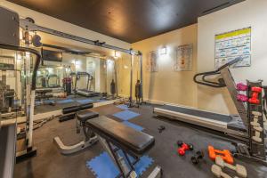 a gym with several treadmills and machines at Luxury Condo Steps to Park City Mountain Resort! Heated Pool & Hot Tub -Snowblaze 309 in Park City