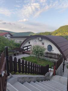a building with a fence in front of it at Holiday Home Casa Rondo in Bihać
