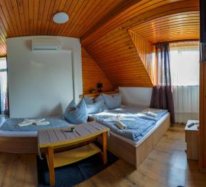 Postel nebo postele na pokoji v ubytování Zomi Vendégház