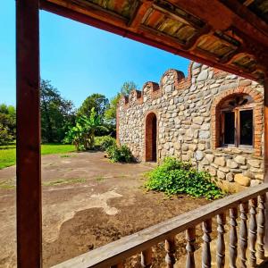 a view of a stone building from a balcony at Blue Guest House in Samtredia