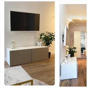 a living room with a tv on a wall at Nice vacation in Poreč