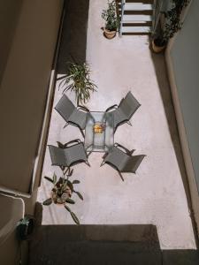 an overhead view of a patio with chairs and plants at CentroCitta Luxury House in Argostoli +96 photos