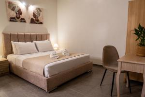 Ένα ή περισσότερα κρεβάτια σε δωμάτιο στο Cristina Apartments