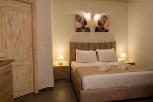 Ένα ή περισσότερα κρεβάτια σε δωμάτιο στο Cristina Apartments
