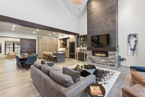 a living room with a couch and a fireplace at Slopeside 129 in Whitefish