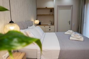 Ένα ή περισσότερα κρεβάτια σε δωμάτιο στο Cristina Apartments