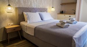 Ένα ή περισσότερα κρεβάτια σε δωμάτιο στο Cristina Apartments