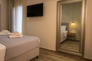 Ένα ή περισσότερα κρεβάτια σε δωμάτιο στο Cristina Apartments