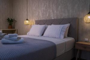 Ένα ή περισσότερα κρεβάτια σε δωμάτιο στο Cristina Apartments