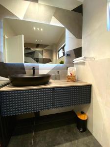 a bathroom with a black sink and a mirror at Villa 5 in Makarska +60 photos