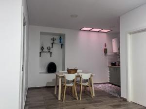 a dining room with a table and chairs at Imperial Douro Apartamento 3 in Peso da Régua
