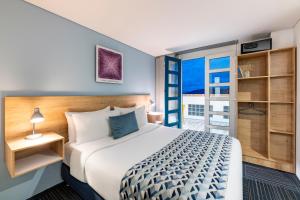 En eller flere senge i et værelse på Hotel Camino de la Sal