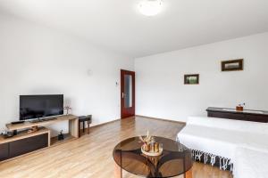 a living room with a couch and a table at Apartman Marco Polo in Selce