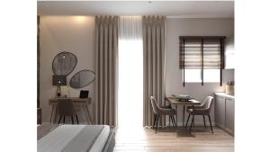 una camera con letto, tavolo e sedie di Cristina Apartments a Gaios