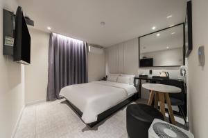Katil atau katil-katil dalam bilik di Greaten Hotel