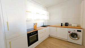 Kuchyň nebo kuchyňský kout v ubytování Grand Apt 130m2 vue place ducale
