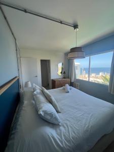 Cama ou camas em um quarto em ZAG Coliving Punta del este