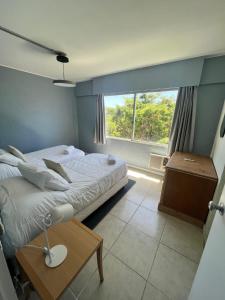 Cama ou camas em um quarto em ZAG Coliving Punta del este