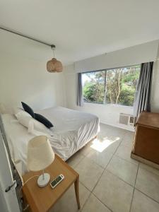Cama ou camas em um quarto em ZAG Coliving Punta del este