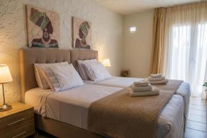 Ένα ή περισσότερα κρεβάτια σε δωμάτιο στο Cristina Apartments