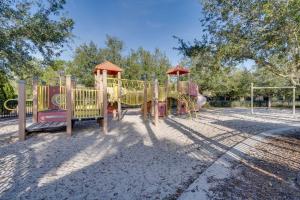 a park with a playground with a slide at Disney Area Vacation Rental with Game Room and Pool! in Davenport