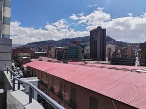 a view of a city from the roof of a building at HOTEL PLATINIUM in La Paz