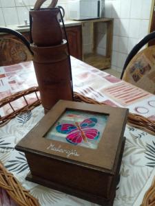a box on a table with a butterfly on it at La Soñada in Malargüe