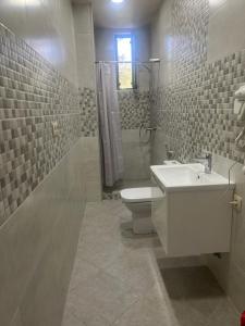 a bathroom with a sink and a toilet and a shower at Sunrise Grigoleti in Grigoleti +45 photos