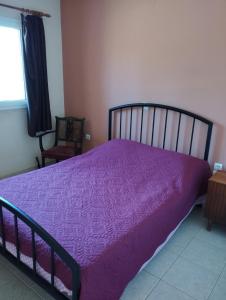 Postel nebo postele na pokoji v ubytování ROMVI VILLAGE