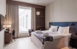 Postel nebo postele na pokoji v ubytování Home Hotel Tapetfabriken