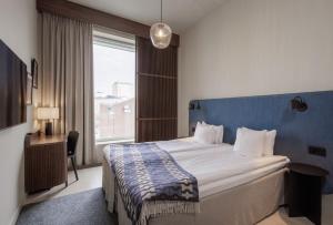 Postel nebo postele na pokoji v ubytování Home Hotel Tapetfabriken