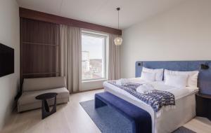 Postel nebo postele na pokoji v ubytování Home Hotel Tapetfabriken