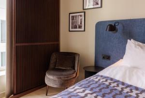 Postel nebo postele na pokoji v ubytování Home Hotel Tapetfabriken