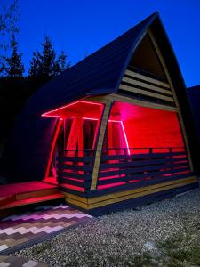 a small building with red lights on the inside at U Yaroslava Hotel in Yaremche