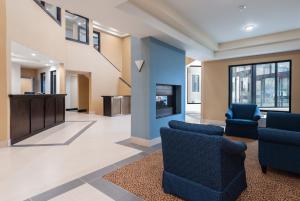 a lobby with two chairs and a podium at Days Inn by Wyndham Tamworth in Tamworth