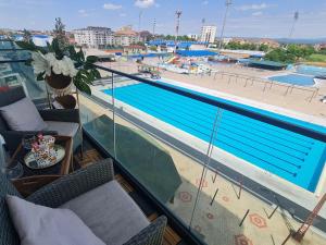 a view of a swimming pool from a balcony at RELAX LUX AKVA PARK(K-KOMPLEX) in Jagodina