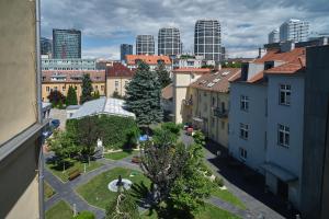 an aerial view of a city with tall buildings at Centrum Salvator in Bratislava